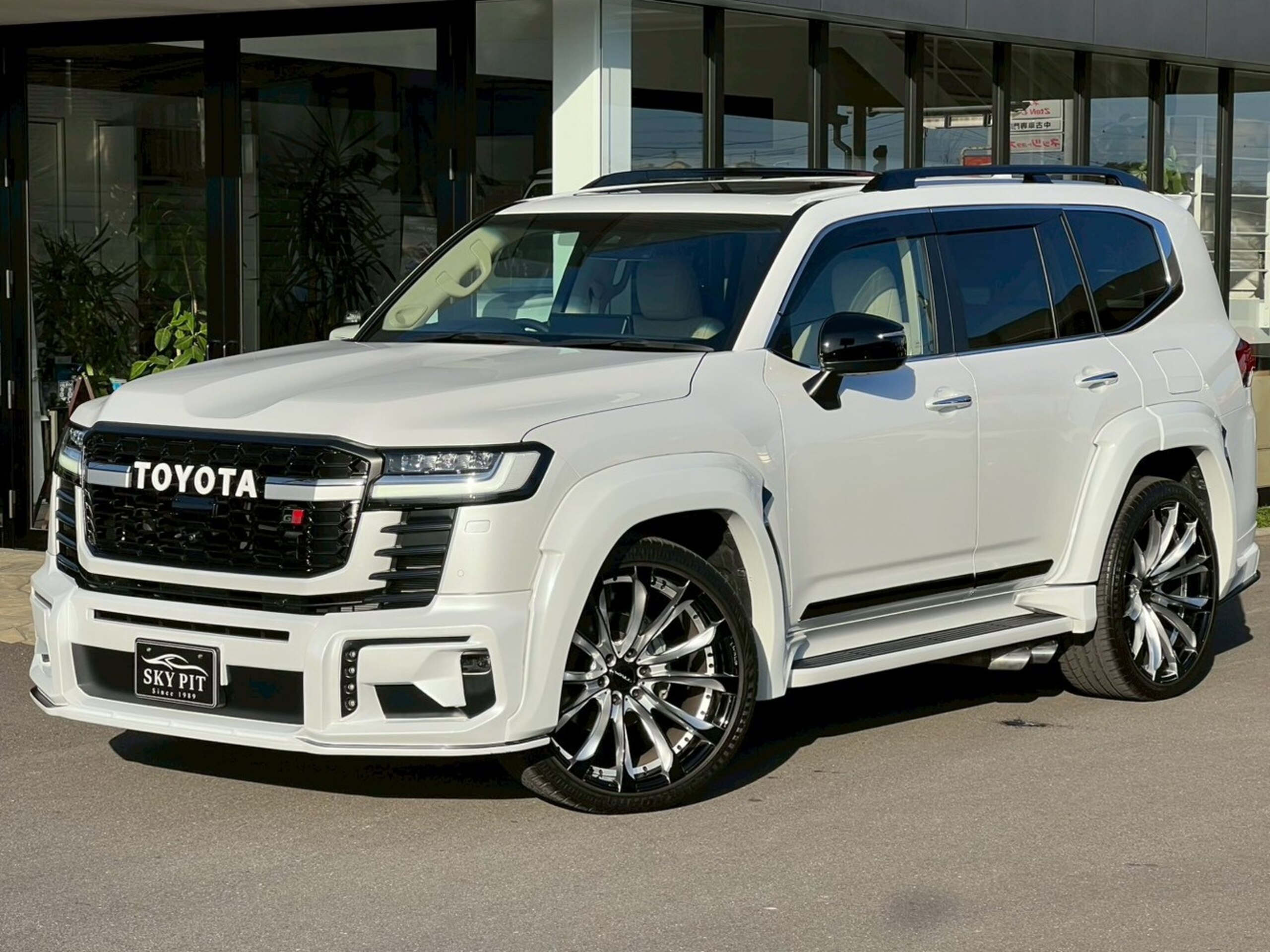 Toyota Land Cruiser 300 3.5 ZX 4WD with WALD Aero Kit, 24-inch AW Wheels, Quad Exhaust, Electric Rear Diff Lock, Cool Box, Rear Entertainment, Hitch Member, GR Grille, and Factory Muffler