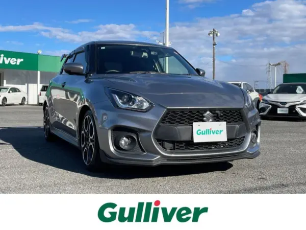 Suzuki Swift Sport 1.4 with Safety Package, Aftermarket Aero, TEIN Coilovers, Monster Sports Carbon GT Wing, HKS Exhaust, HKS Air Cleaner, BLITZ Strut Bar, Aftermarket LED Tail Lamps, Factory 8-inch Navigation, 360-Degree Camera, Suzuki Safety Support, Adaptive Cruise Control (Premium Silver Metallic) — thumbnail 1