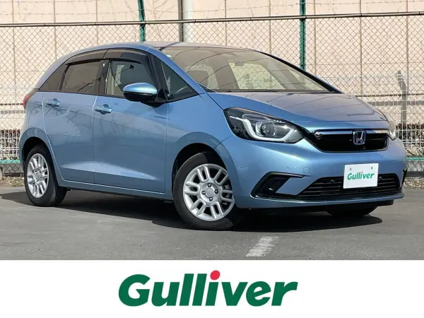 Honda Fit 1.5 e:HEV Home, Genuine 8-inch Navi, Honda Sensing, Modulo AW, Adaptive Cruise Control, Front/Rear Dashcam, Built-in ETC, Full-Seg TV, Bluetooth, DVD Playback, Corner Sensors, Collision Mitigation, Backup Camera, Non-Smoking Car (Air Light Blue Metallic) — thumbnail 1