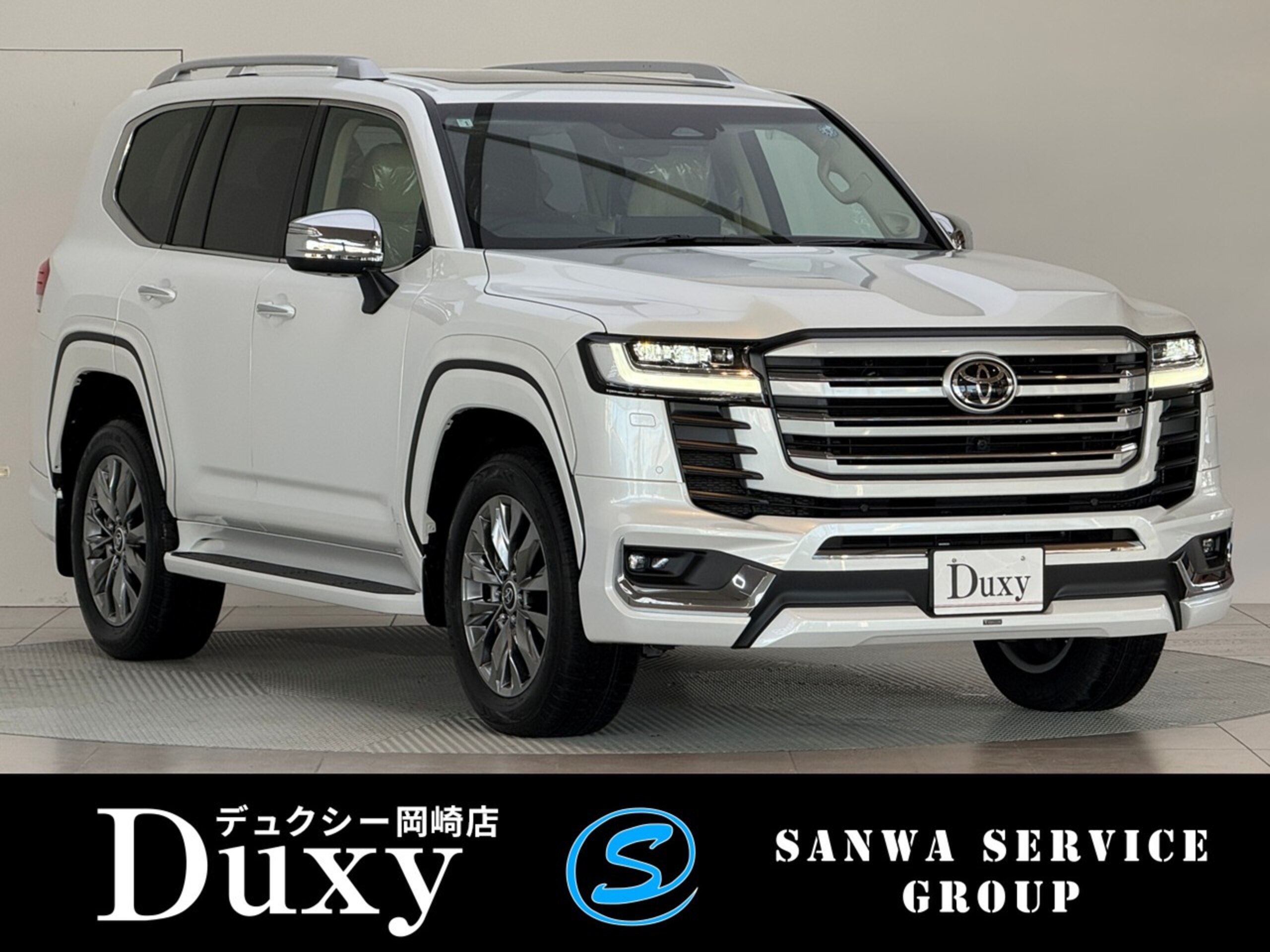 Toyota Land Cruiser 300 3.5 ZX 4WD 2026 Model Modellista Aero + Rear Spoiler 12.3-inch JBL Premium Navigation Rear Entertainment System Cool Box Electric Diff Lock Tire Pressure Sensor Cold Weather Specification Tonneau Cover Roof Rail Beige Interior (Precious White Pearl)