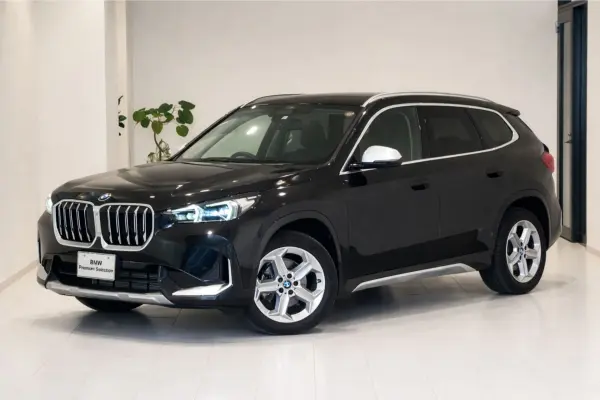 BMW X1 xDrive20i x-Line DCT 4WD Technology Package Sensor Tech Black Leather Seats Seat Heater Hands-Off Assist Power Trunk HUD Top View Camera Non-Smoking Vehicle Certified Used Car Nationwide Official Dealer Warranty 2 Years Unlimited Mileage (Black Sapphire Metallic) — thumbnail 1