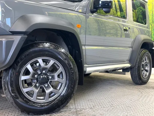 Suzuki Jimny Sierra 1.5 JC 4WD with Genuine Navigation, Backup Camera, Cold Climate Spec, Collision Mitigation System, AC 100V, Non-Smoking Car, Water-Repellent Seats, Seat Heaters, Smart Key, LED Headlights, ETC, Cruise Control, Lane Departure Warning, Misacceleration Mitigation (Medium Gray) — photo 9