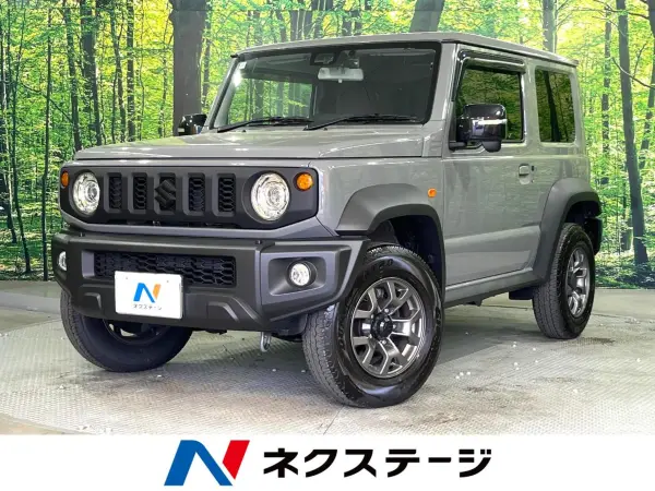 Suzuki Jimny Sierra 1.5 JC 4WD Non-Smoking Car Genuine 9-inch Navi Backup Camera Collision Damage Mitigation System Corner Sensor Smart Key LED Headlights Built-in ETC Cruise Control Genuine 16-inch Alloy Wheels Lane Departure Warning Auto Lights (Medium Gray) — thumbnail 1