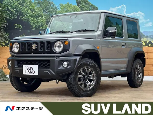 Suzuki Jimny Sierra 1.5 JC 4WD with SD Navigation, Backup Camera, Collision Damage Mitigation System, Cruise Control, Non-Smoking Car, Smart Key, LED Headlights, ETC, Genuine 15-inch Alloy Wheels, Lane Departure Warning, Auto Lights, Dual Air Conditioning (Medium Gray) — thumbnail 1