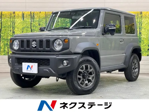 Suzuki Jimny Sierra 1.5 JC 4WD with 9-inch Navigation, Backup Camera, Collision Mitigation System, Non-Smoking Car, Seat Heater, Dashcam, ETC, Smart Key, Cruise Control, Lane Departure Warning, Auto Lights, Auto Air Conditioning, Genuine 15-inch AW Wheels, Bluetooth Playback (Medium Gray) — thumbnail 1