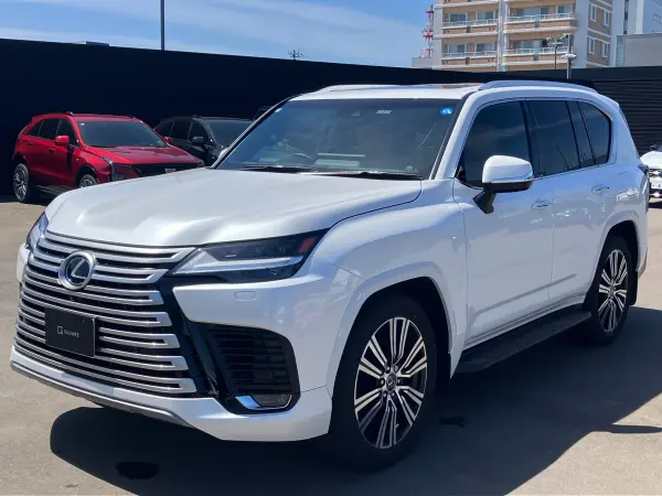 Lexus LX600 4WD Right Hand Drive / Sonic Quartz (White) / Beige Interior / Lexus Safety System+ / Pre-Crash Safety / Lane Tracing Assist / Adaptive High Beam System / Roadside Assist / Radar Cruise (Sonic Quartz) — thumbnail 1