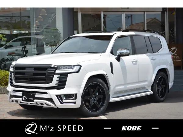 Toyota Land Cruiser 300 3.5 ZX 4WD ZEUS / Aero 3-point, 4-outlet muffler carbon tail, over fender, front line LED, front grille, rear gate spoiler, fender duct, pillar panel, door mirror cover, 22AW JBL, cold region specification (Precious White Pearl) — thumbnail 1